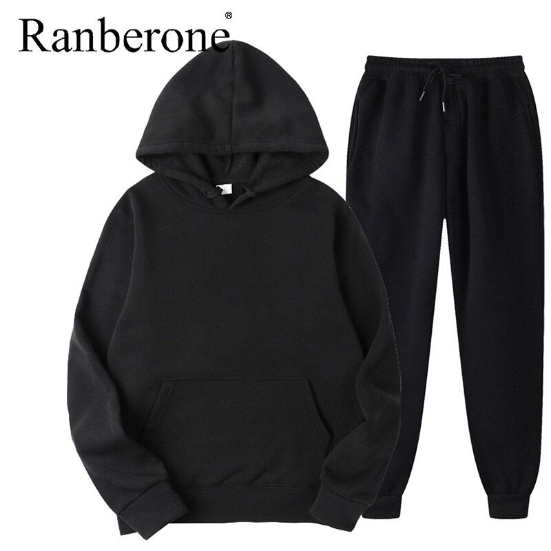 Solid color hooded sweatshirt and matching pants set