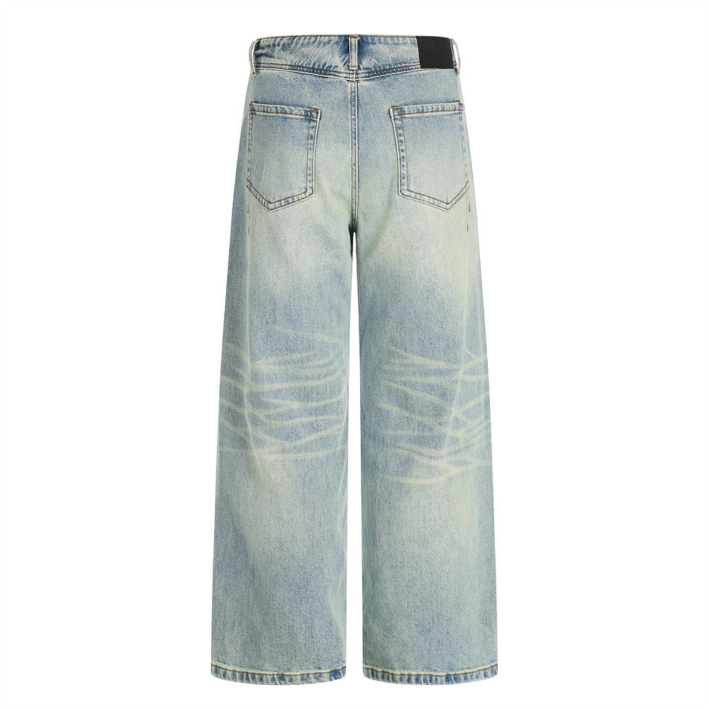 Jeans homme en denim délavé.