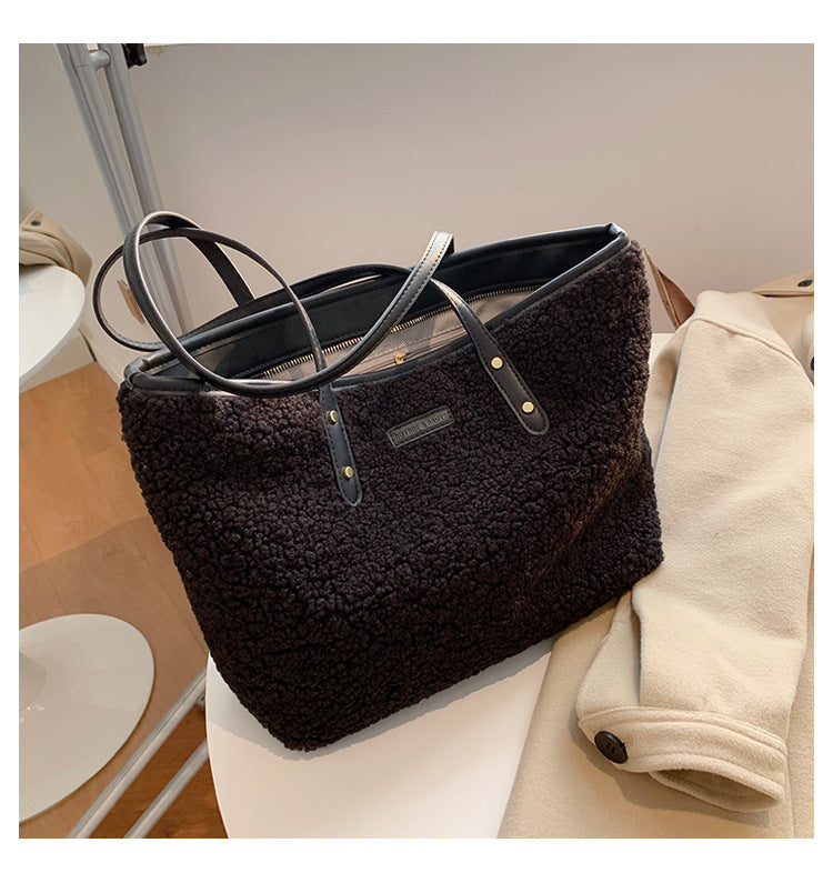 large lambskin-style tote bag with zipper and pockets