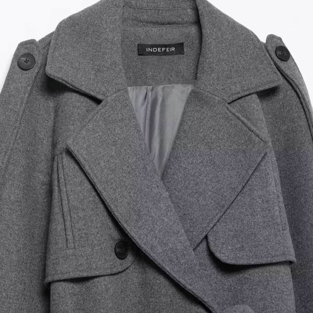 Double breasted coat with belt and straps