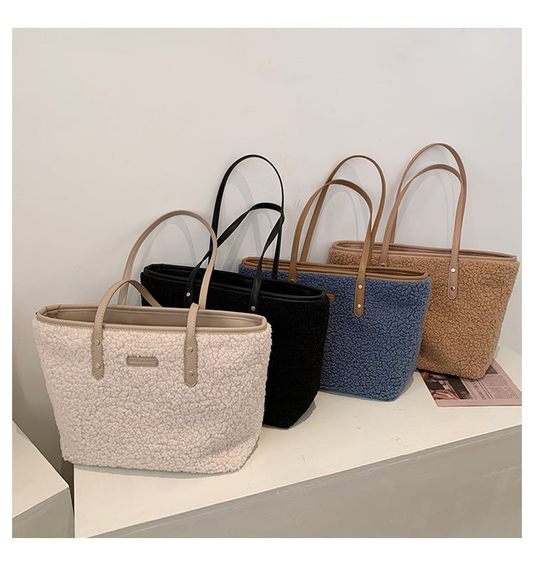 large lambskin-style tote bag with zipper and pockets
