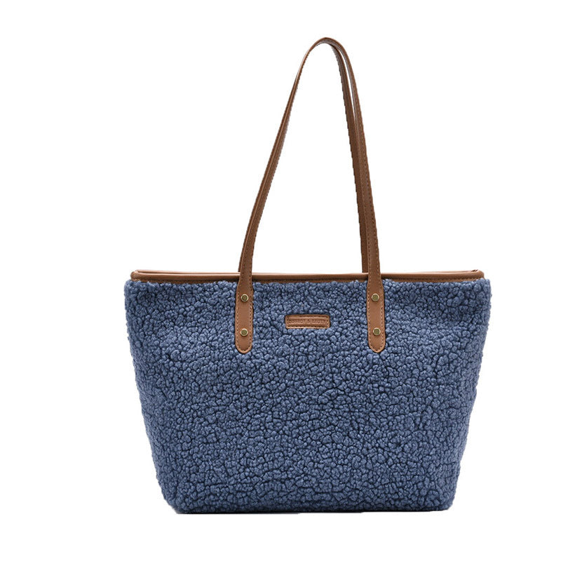 large lambskin-style tote bag with zipper and pockets