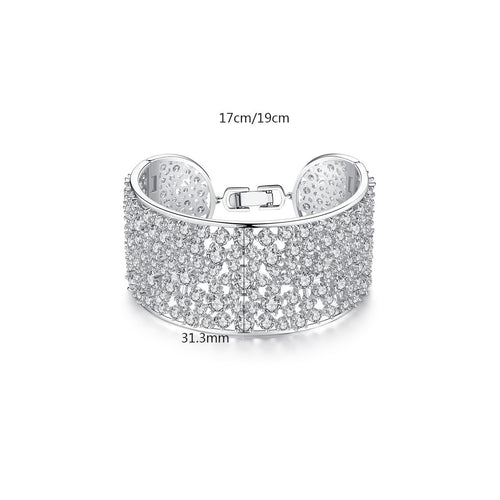 Brass bracelet with zircon inlays