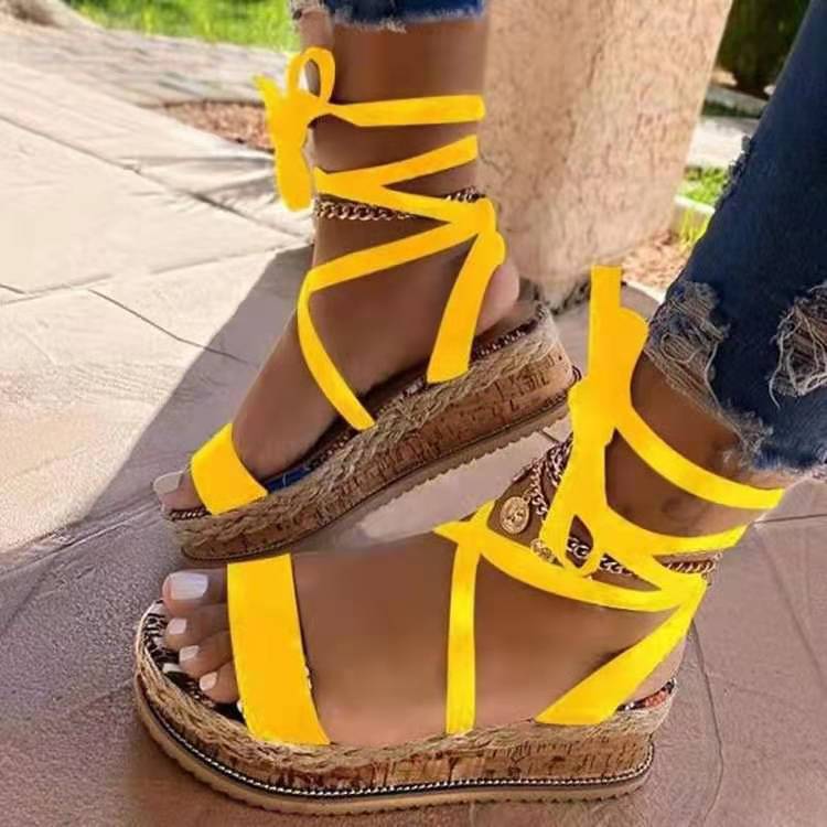 Thick-soled snake-print strappy sandals