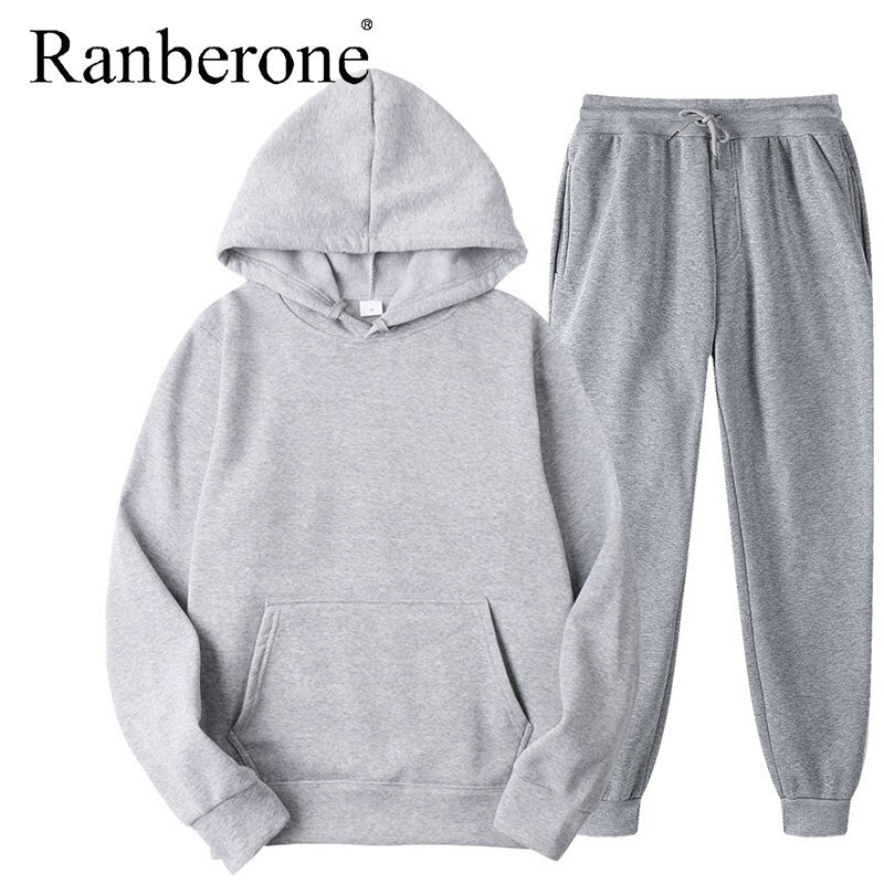 Solid color hooded sweatshirt and matching pants set